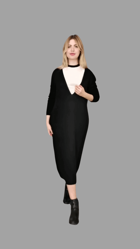 Langes Kleid aus 100 % Merinowolle. Tiefer V-Ausschnitt mit langen Ärmeln in klassischem Schwarz